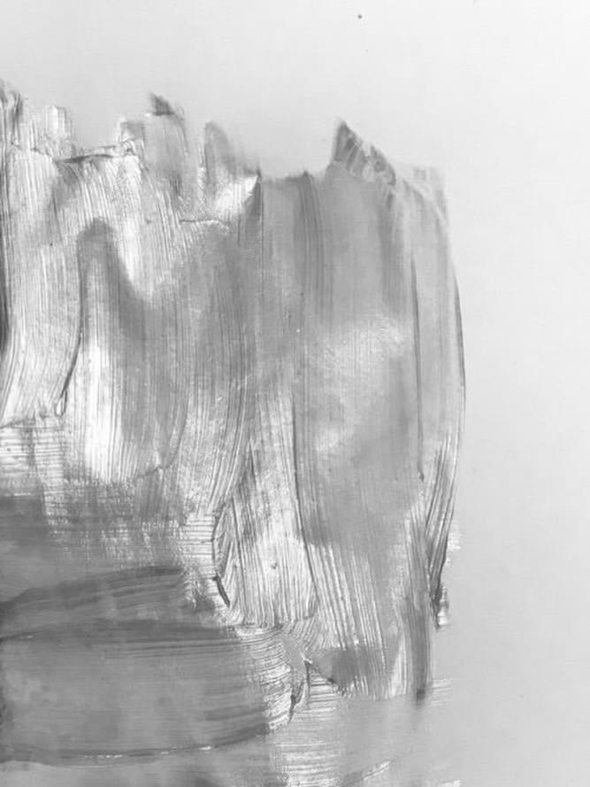 Brushed silver paint on pale ground