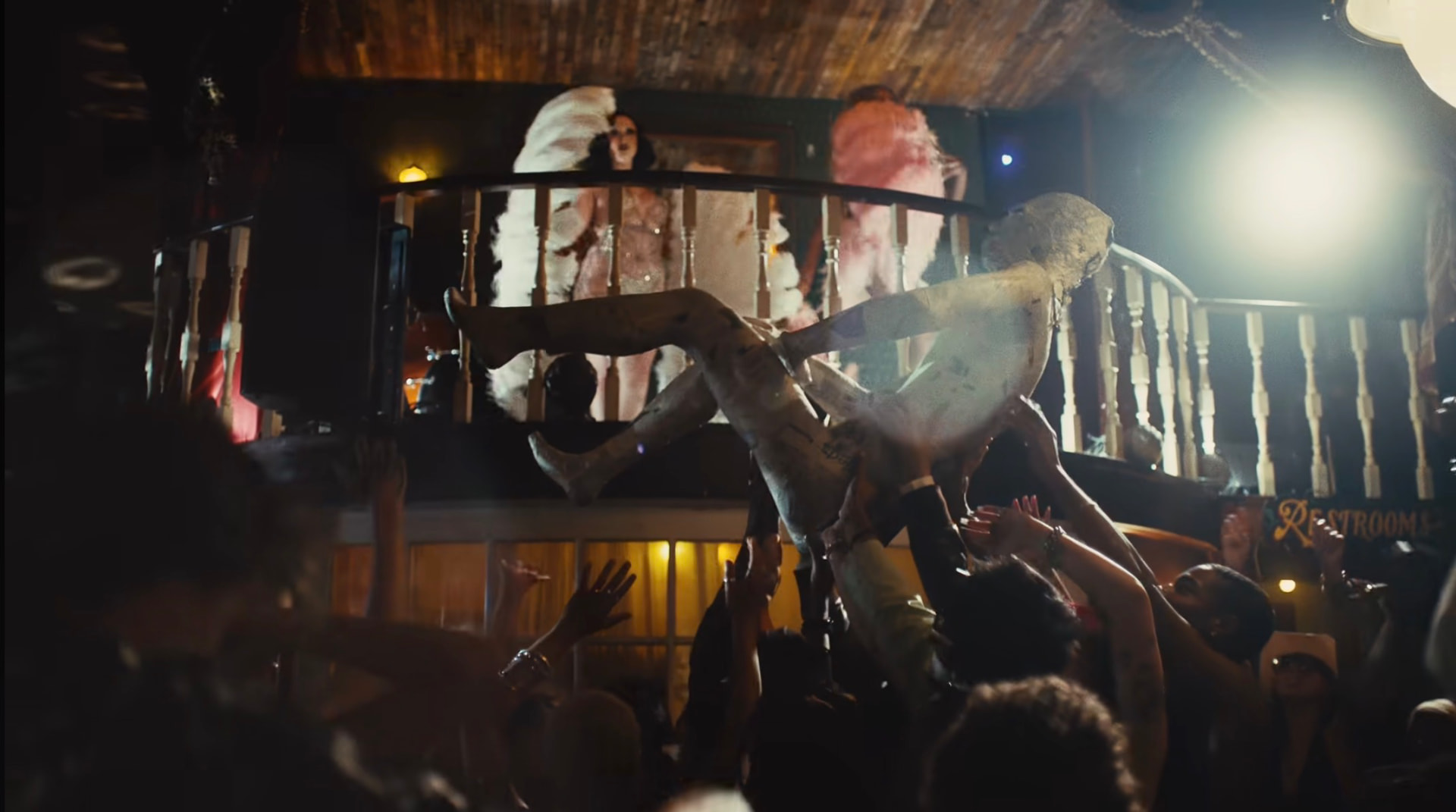 Still from the sombr music video — crowd-surfing ensemble scene